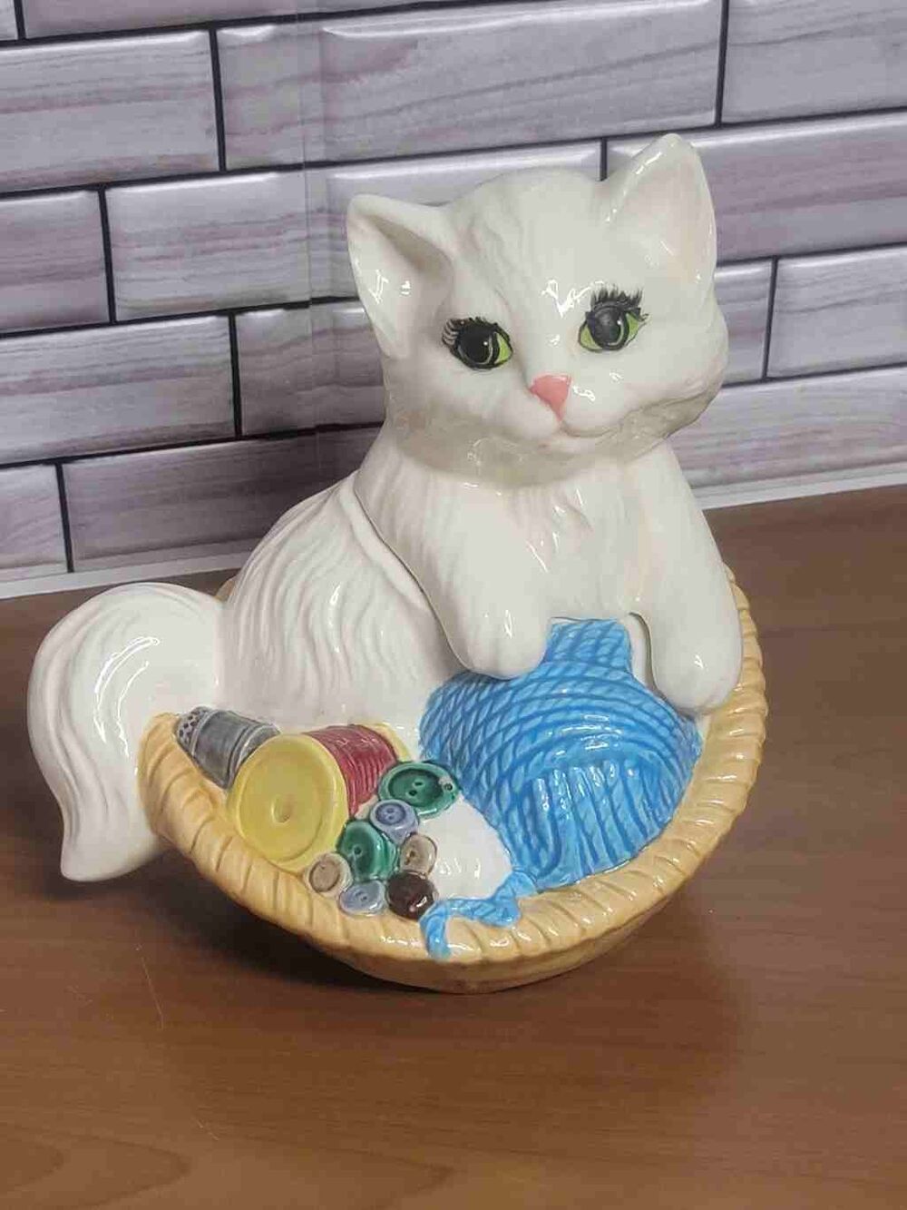 Vintage ceramic white kitten in a brown ceramic basket On Ceramic Yarn